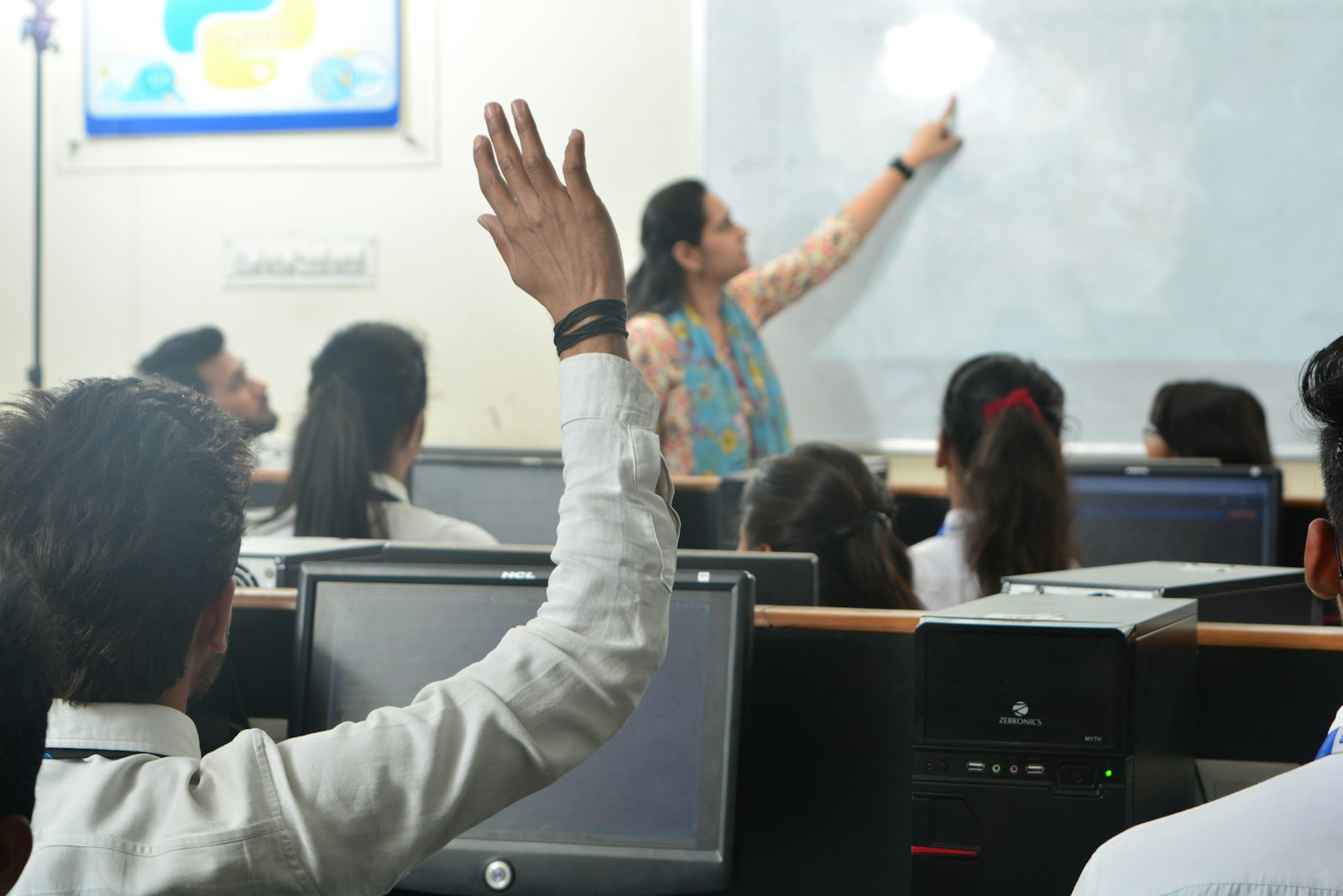 Students and a teacher in a computer classroom